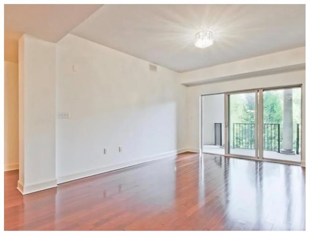 Empty room with light wood-style flooring and baseboards