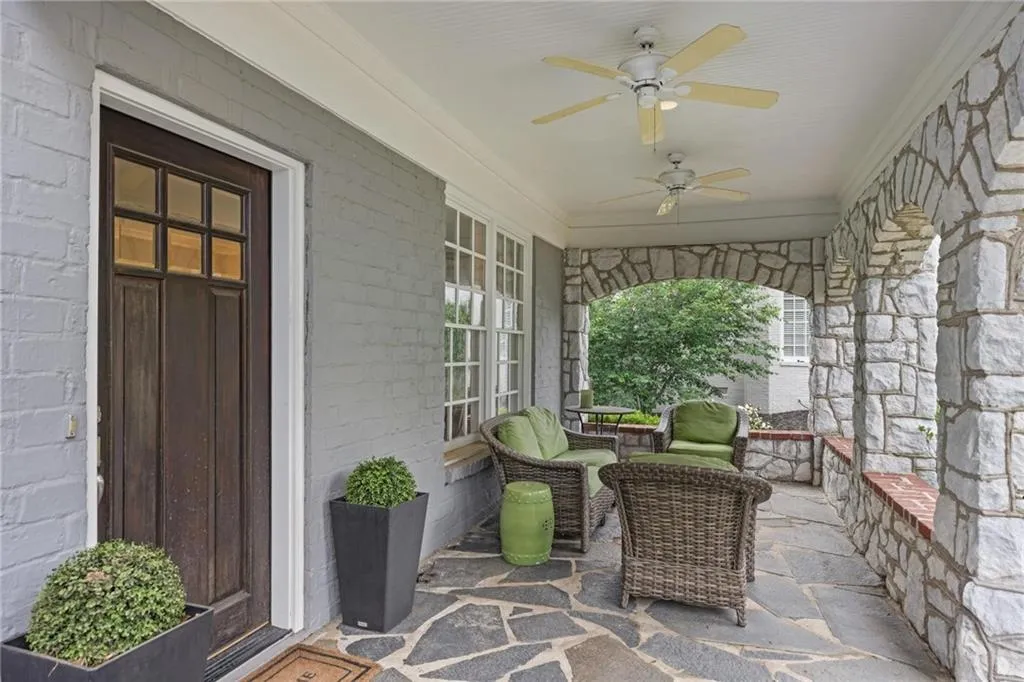 Front porch with slate floors and beautiful arched marble enclosure