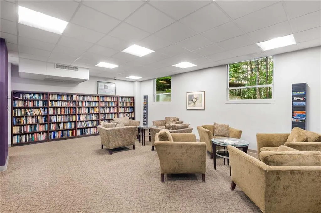Living area featuring a drop ceiling