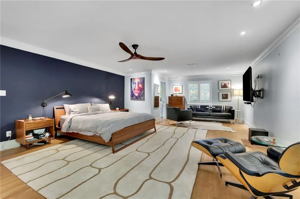 Bedroom with ornamental molding, wood finished floors, recessed lighting, and ceiling fan