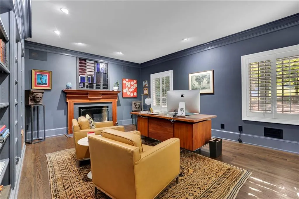 Office space with crown molding, light wood-style floors, and recessed lighting