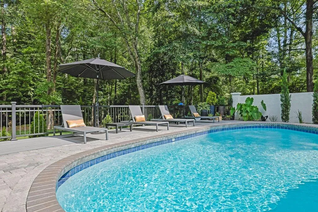 View of pool with view of scattered trees