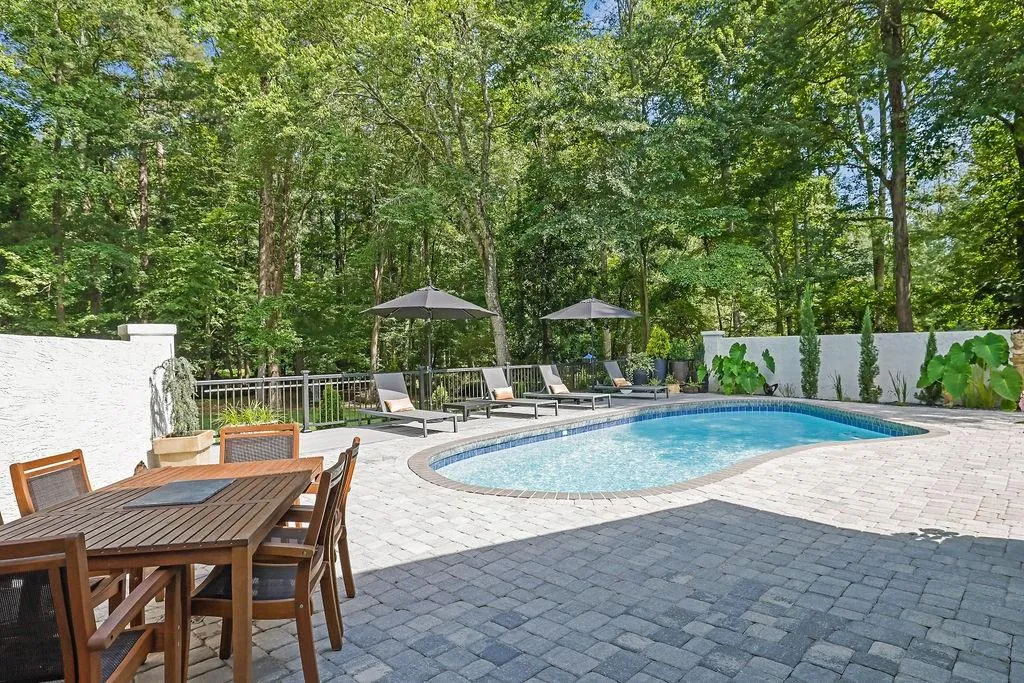 View of swimming pool featuring a patio and outdoor dining space