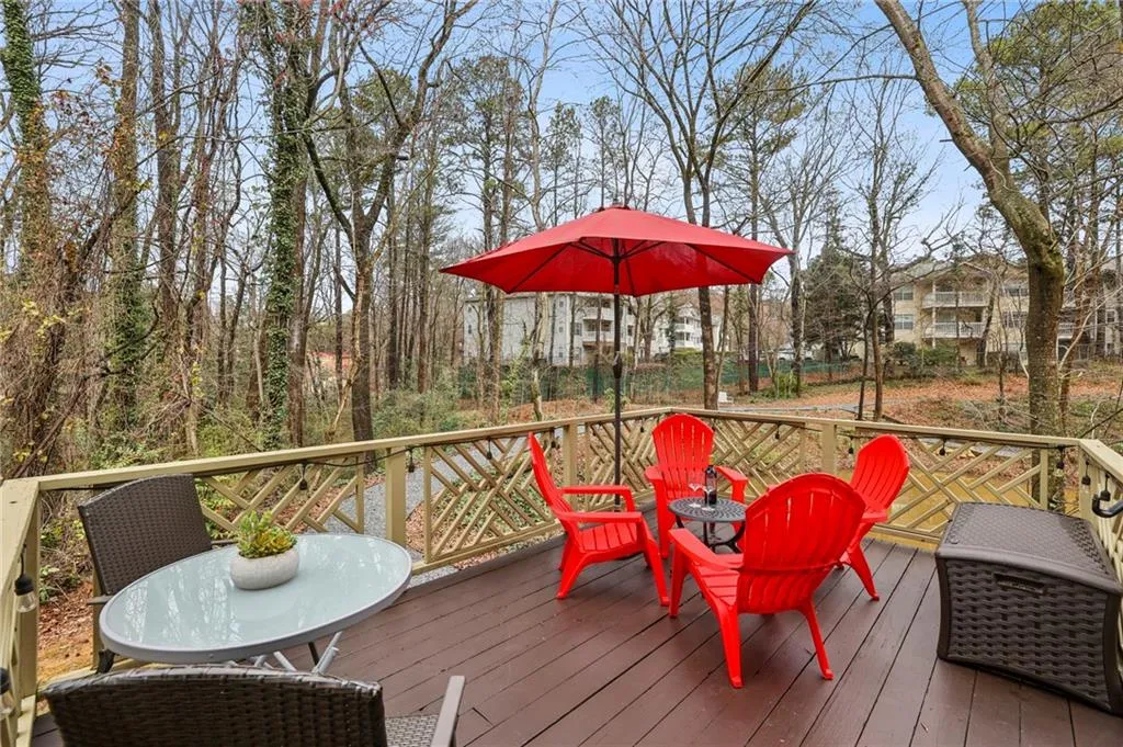 Oversized deck has 2 seating areas and overlooks the duck pond.  Wooded views add to privacy.