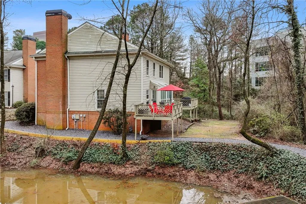 Rear view shows deck, backyard and extra side window with End Unit, and community walking trails.