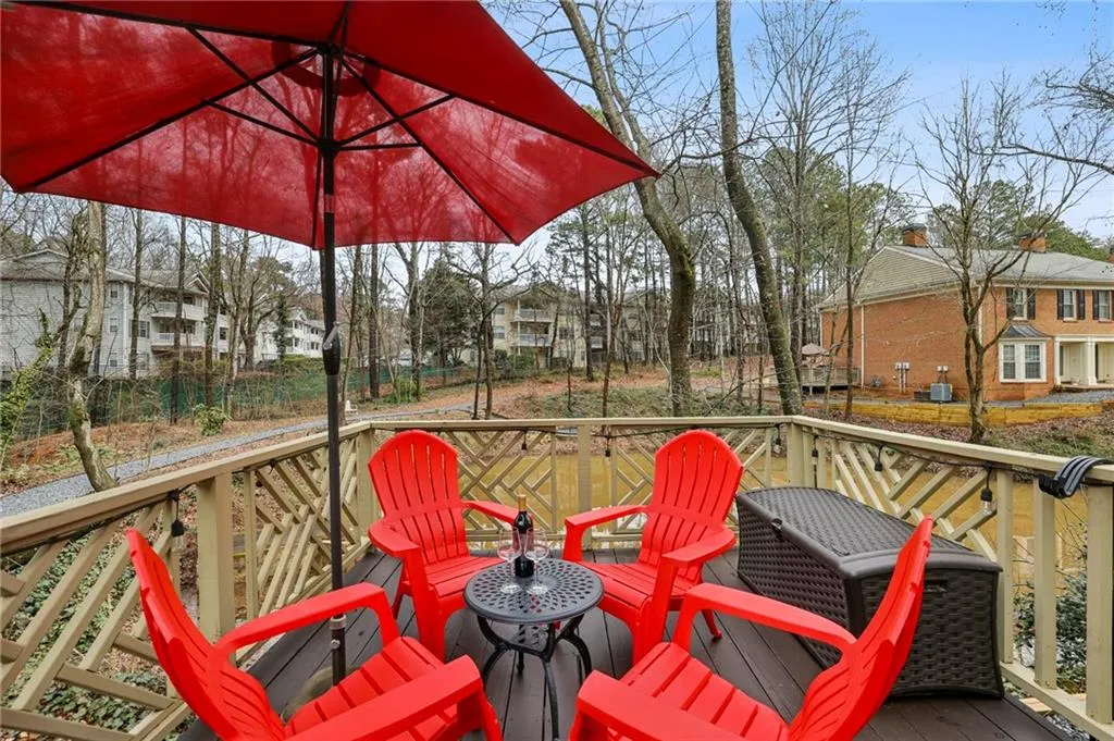 Oversized deck has two seating areas and overlooks the duckpond.