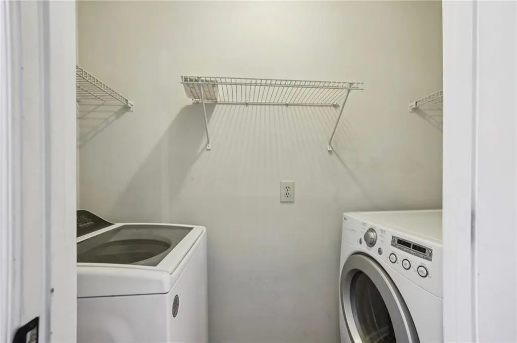 Laundry area with washing machine and clothes dryer