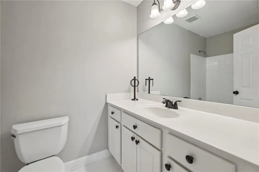 Full bathroom with vanity and a shower