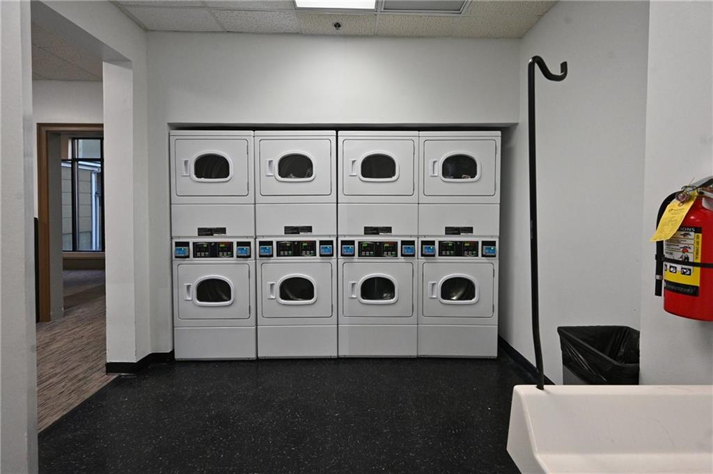 Clothes washing area with washing machine and dryer and stacked washer / drying machine