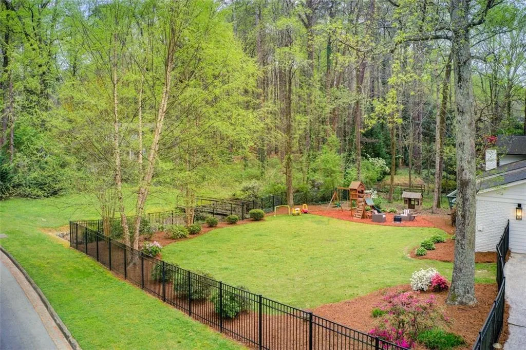 Fenced in Flat Backyard with Beautiful Landscaping