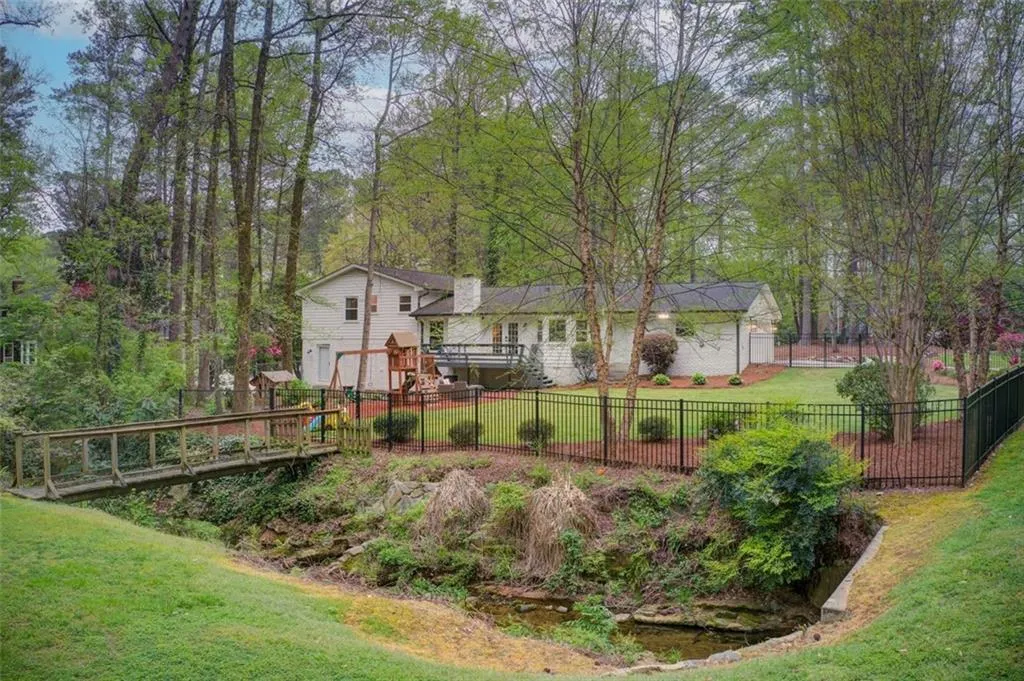 Magnificent .8 Acre Lot Fenced In Backyard with Beautiful Seasonal Plantings