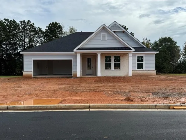 Penrose by McKinley Homes | 2,646 Sq. Ft. Ranch-style home under construction featuring 4 bedrooms, 2.5 baths, open-concept living, a private primary suite, covered rear patio, and 2-car garage.