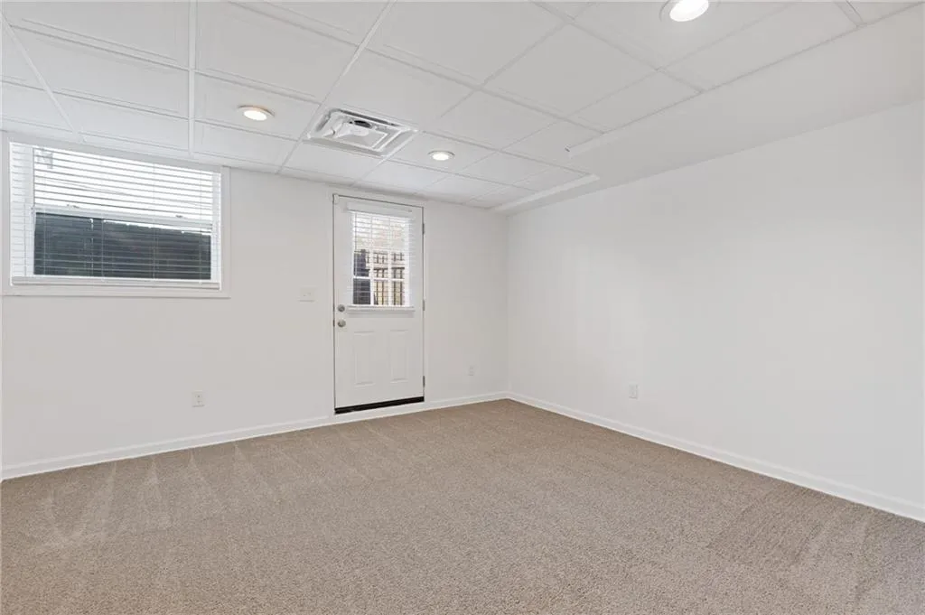 Spare room featuring recessed lighting, visible vents, baseboards, and light colored carpet