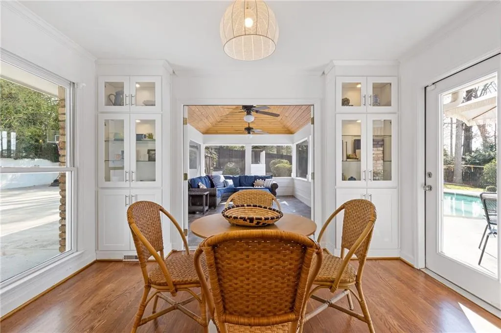 Sunroom / solarium featuring ceiling fan