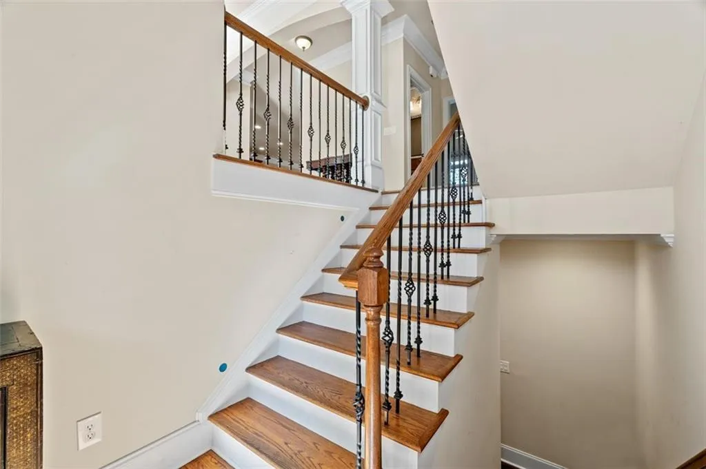 Stairway featuring baseboards