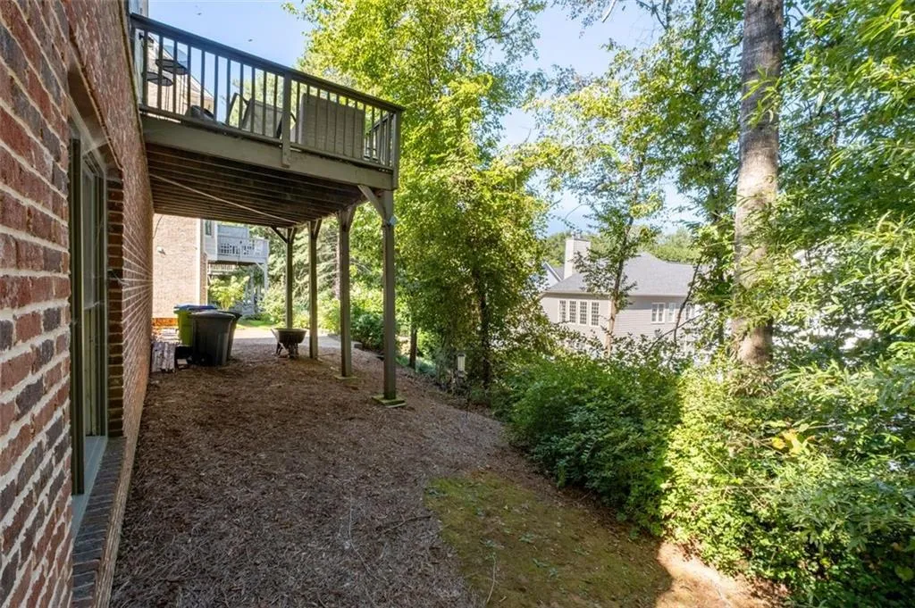 View of yard with a wooden deck