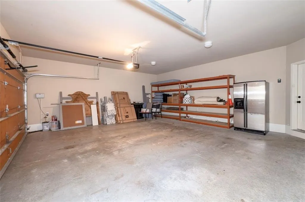 Garage with stainless steel fridge