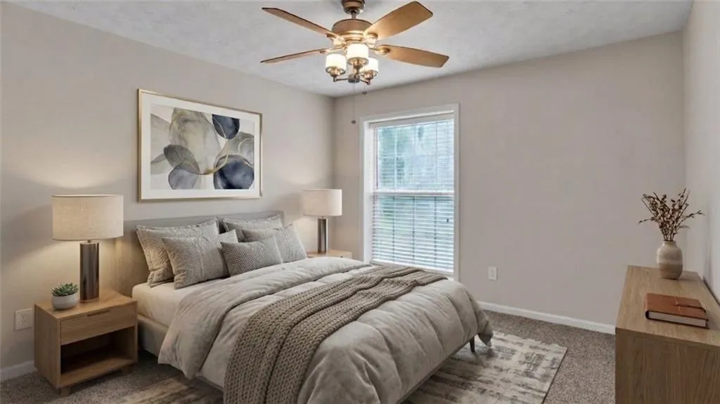 Bedroom featuring carpet flooring and a ceiling fan