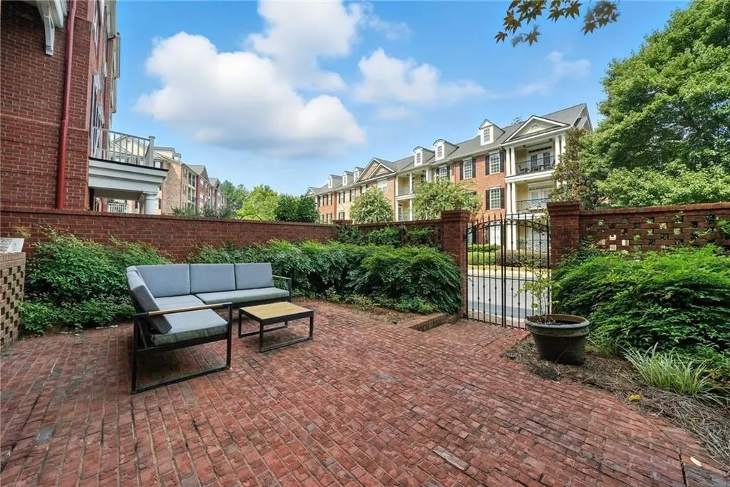 Private Gated Courtyard space for this unit with wrought iron gates to parking area - perfect for pets!