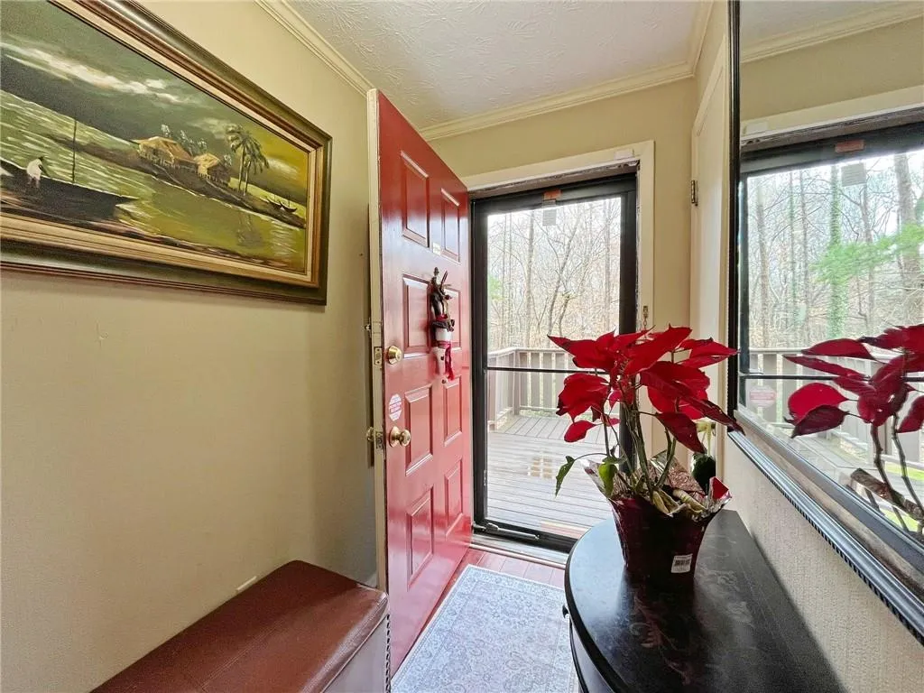 Doorway to outside with ornamental molding