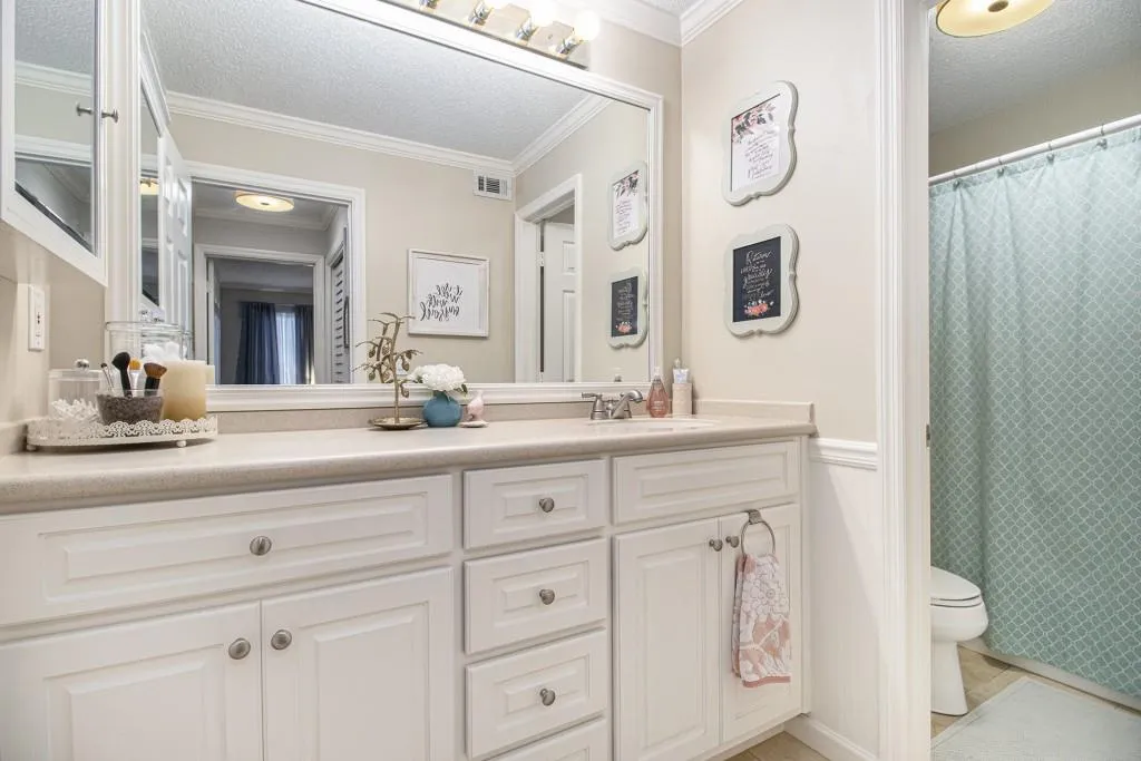 Full Bathroom offers generous counter space and a separate water closet with a shower/tub combo.