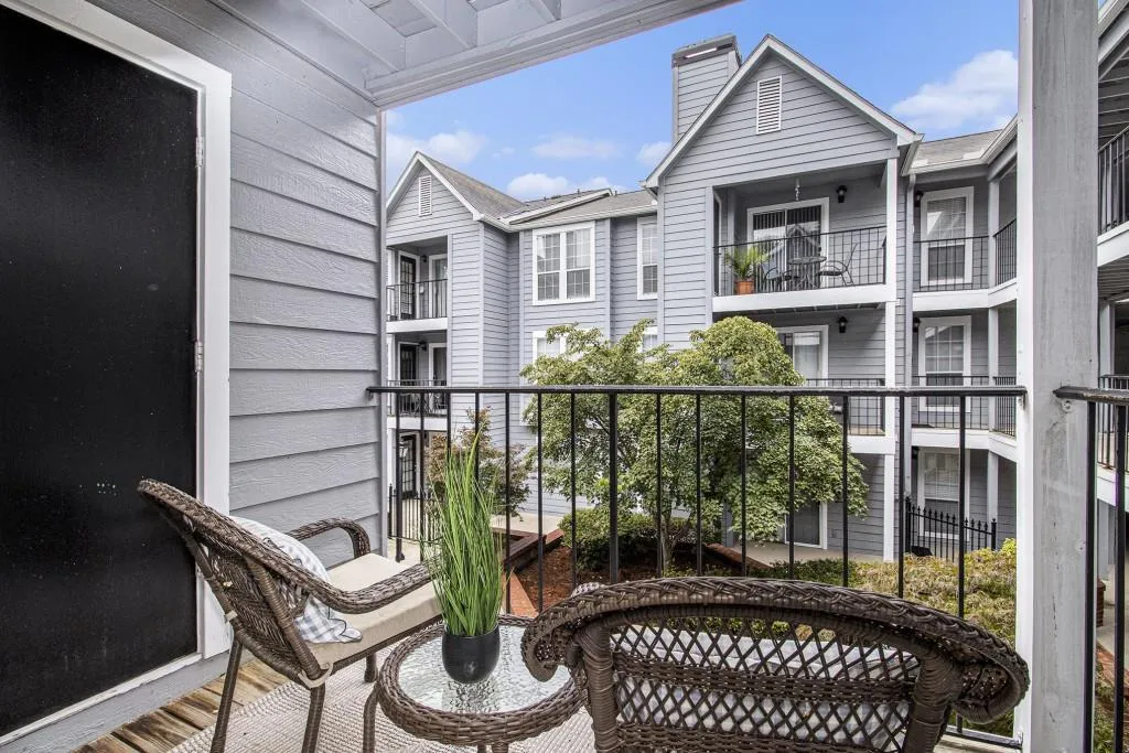Enjoy fresh air and morning coffee on the Covered Balcony overlooking the serene courtyard.