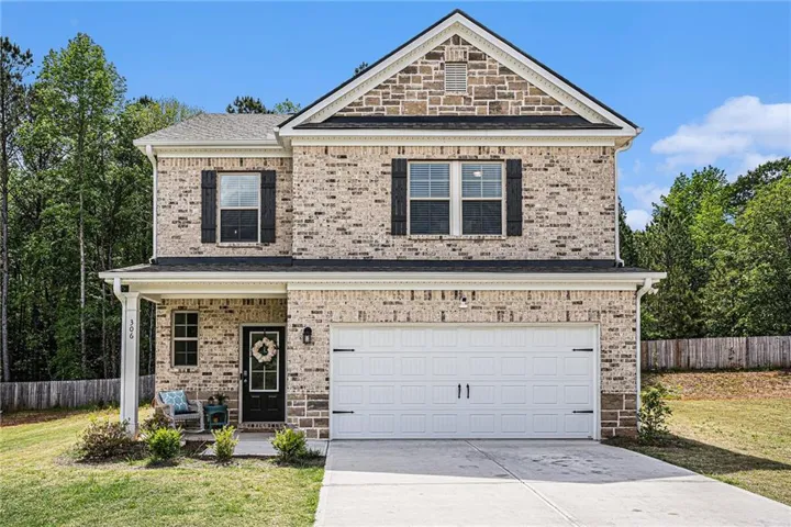 The front of this home is truly a showstopper, featuring a beautiful blend of stone and brick that adds both charm and timeless curb appeal. The rich textures and warm tones create a welcoming first impression, while the craftsmanship speaks to the quality and care put into every detail. It's the perfect blend of classic elegance and modern style that makes you proud to call it home.