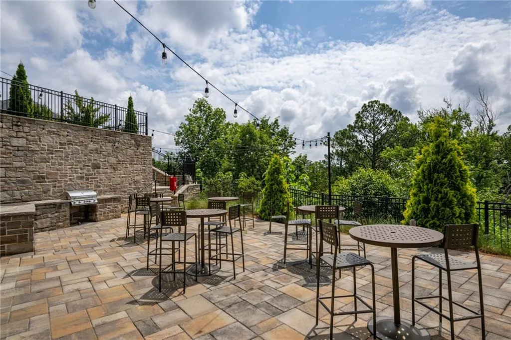 View of patio / terrace featuring outdoor dining space and exterior kitchen