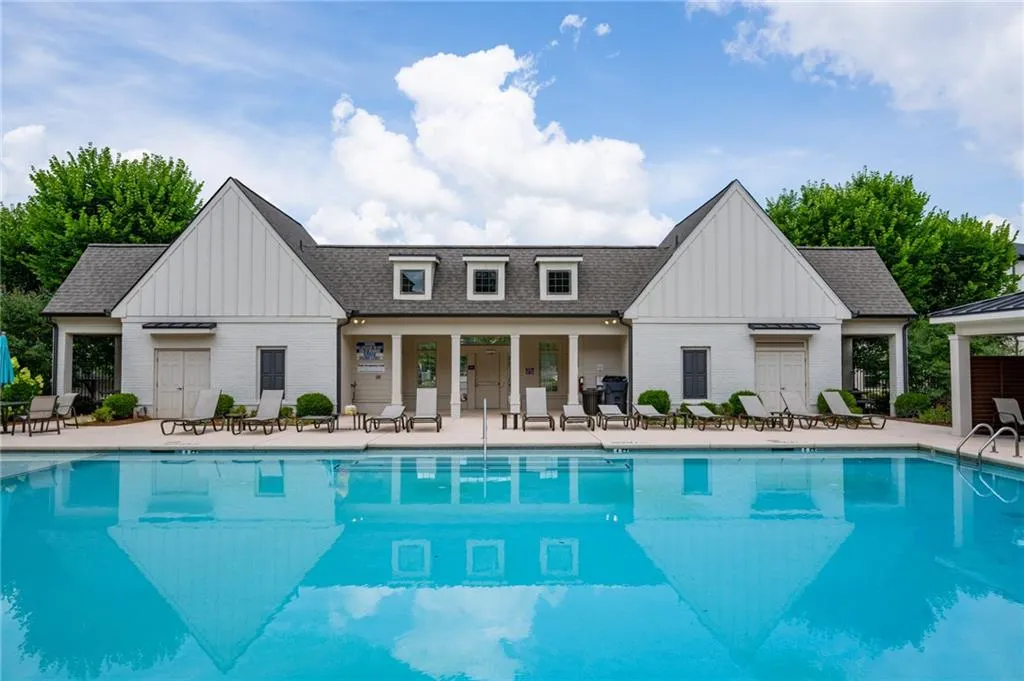 Community pool with a patio