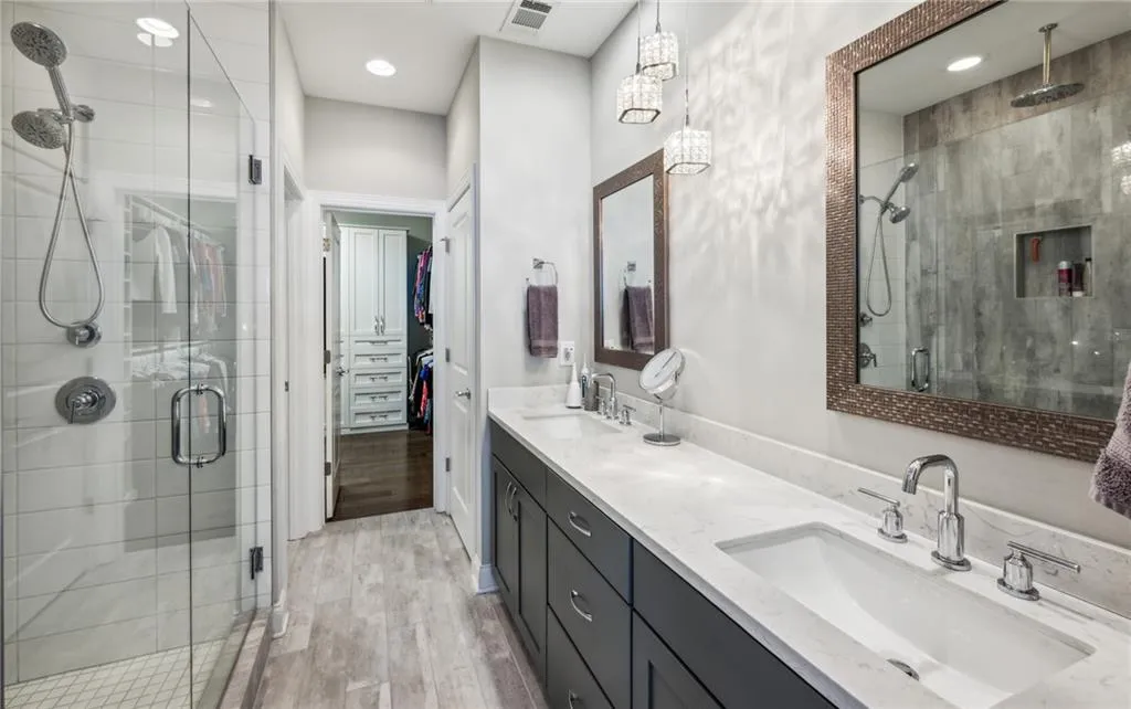 Double vanity and access to the huge walk in closet.