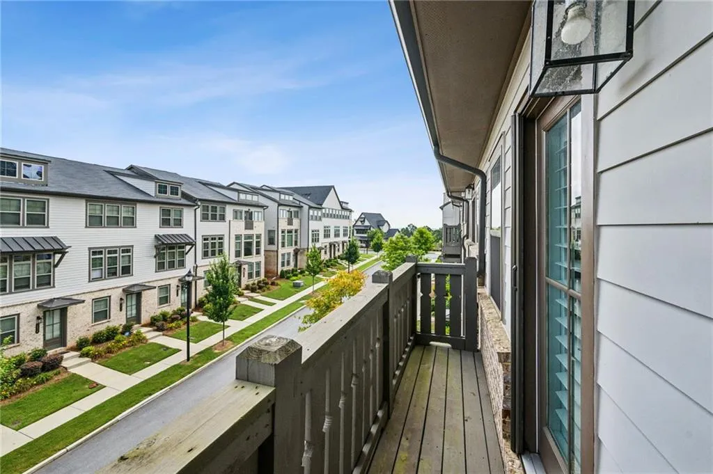 Balcony off the second floor bedroom featuring rooftop views