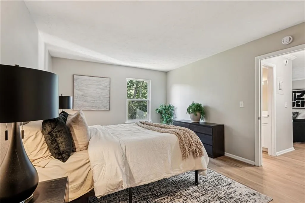 Bedroom featuring light wood-type flooring and baseboards