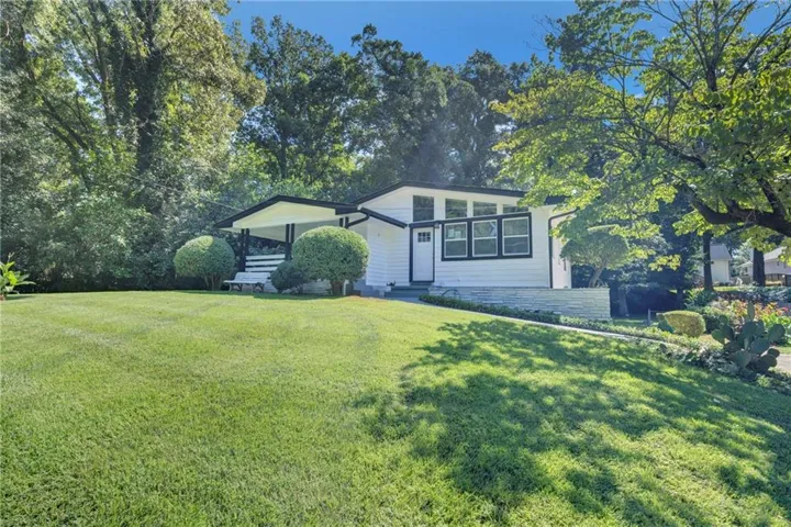 White siding facade with black trim windows