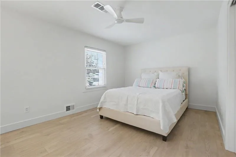 Bedroom featuring light wood-style floors and ceiling fan