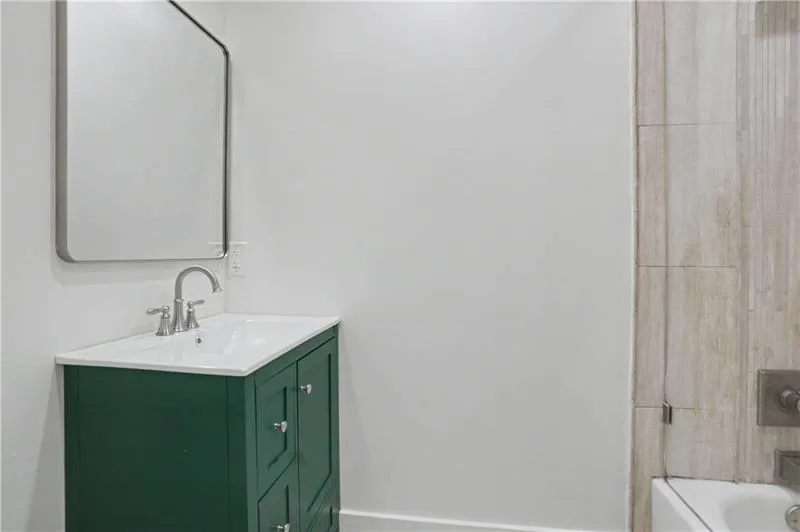 Bathroom with vanity and shower / bath combination
