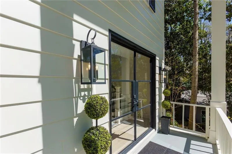 Property entrance featuring custom iron doors