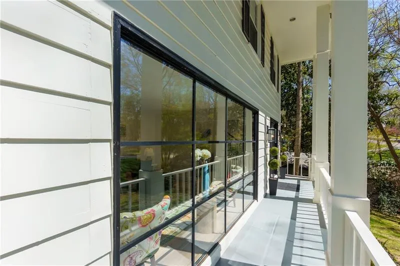 Front porch with beautiful iron window
