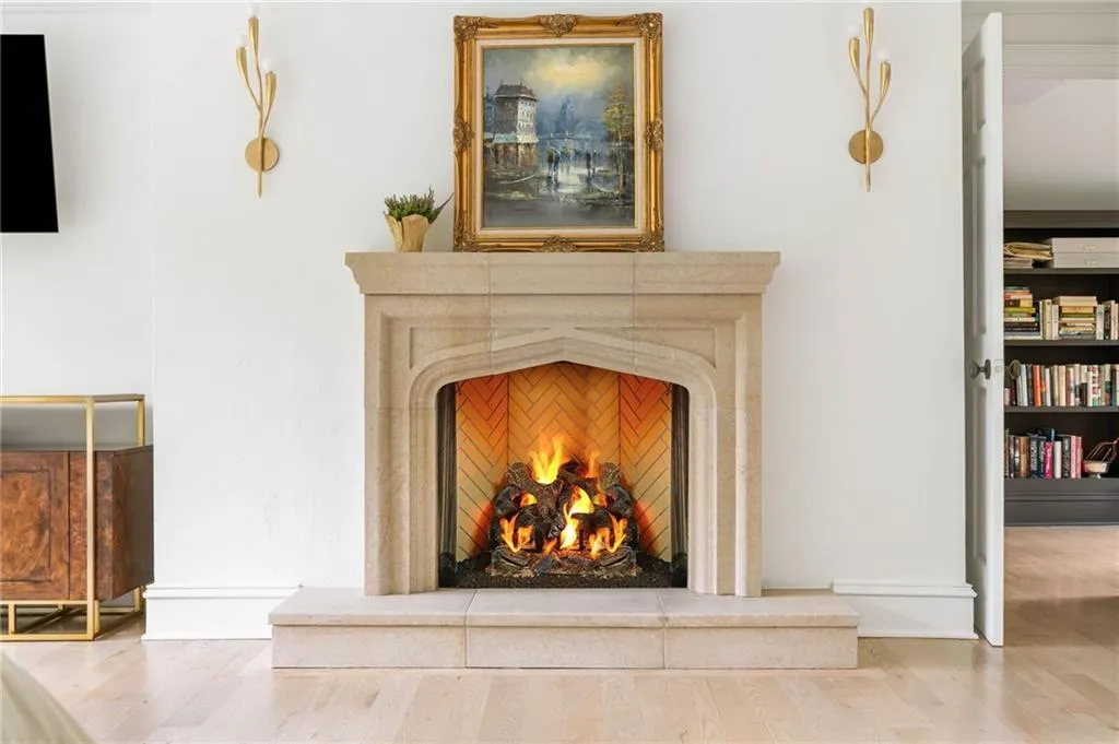 Stone fireplace with a herringbone pattern firebox and hearth