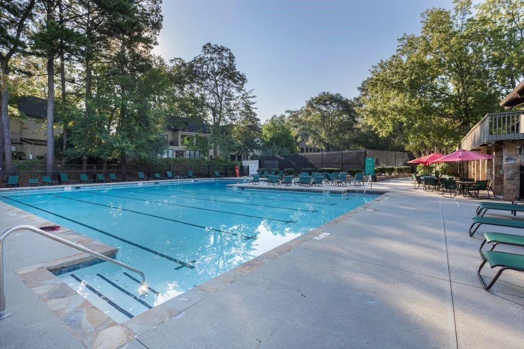 Community pool with a patio area