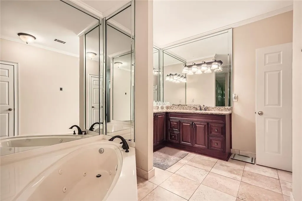 Soaking tub and separate shower in primary bath.