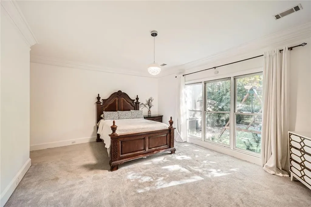 Large primary suite with views to the backyard.