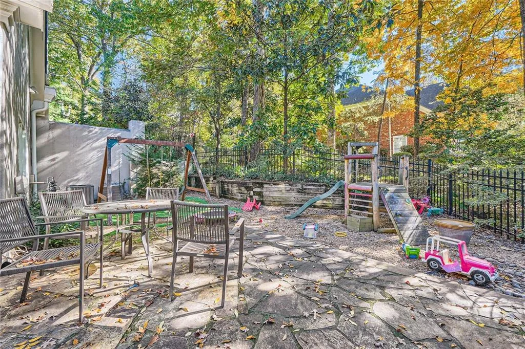 Large, flat, fenced backyard.