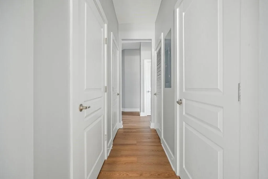 Hall featuring light wood-type flooring Hall featuring light wood-type flooring