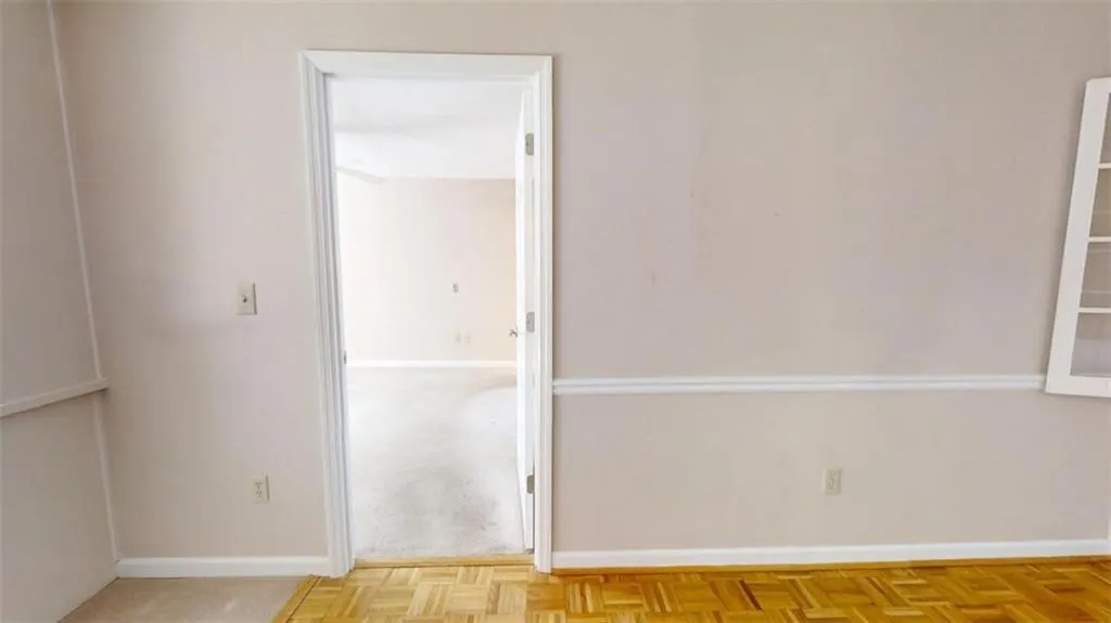 Unfurnished room with baseboards
