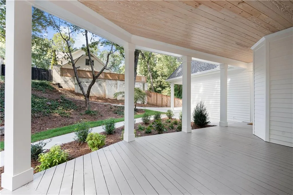 View from the wraparound front porch toward the garage.