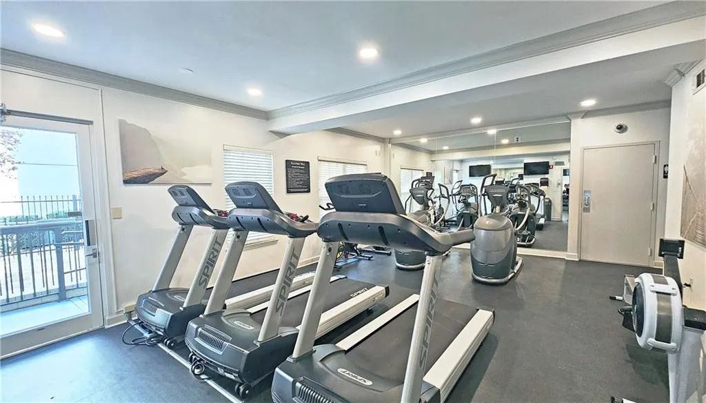 Workout area with recessed lighting and ornamental molding