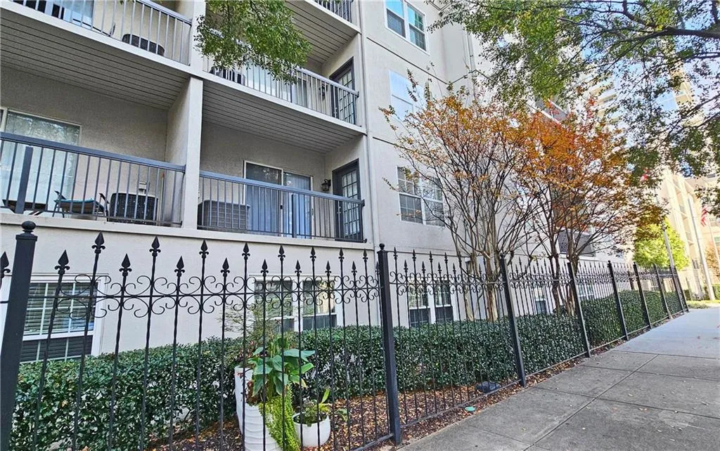 View of property featuring a fenced front yard