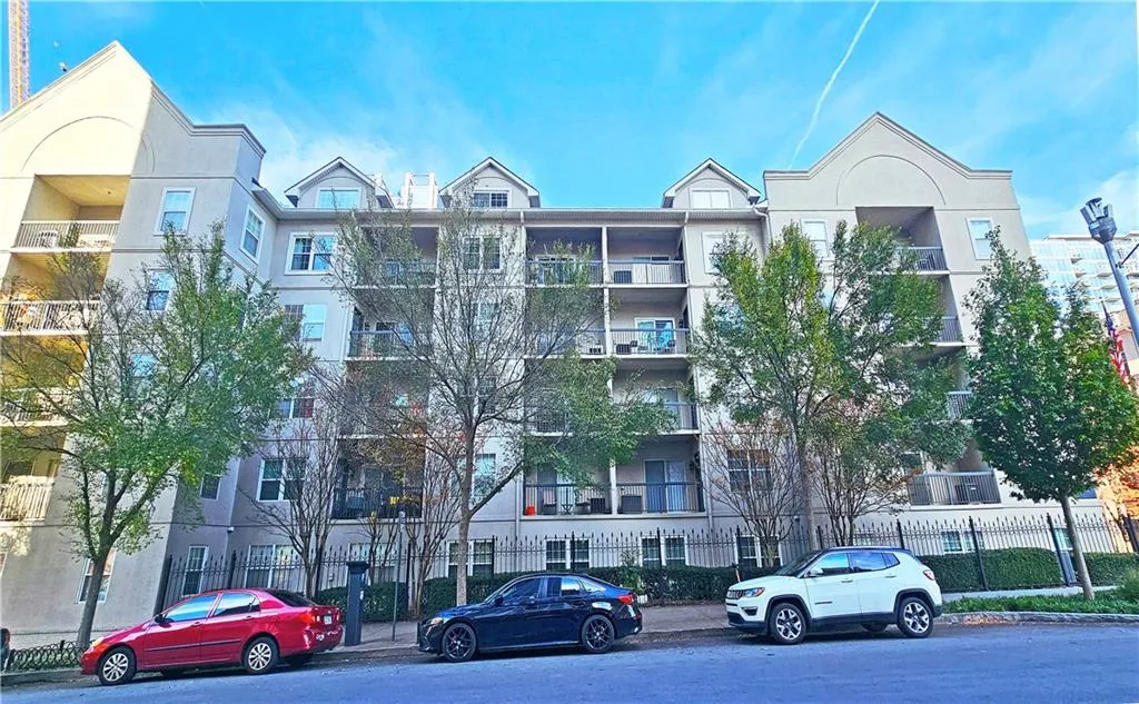 View of property featuring fence