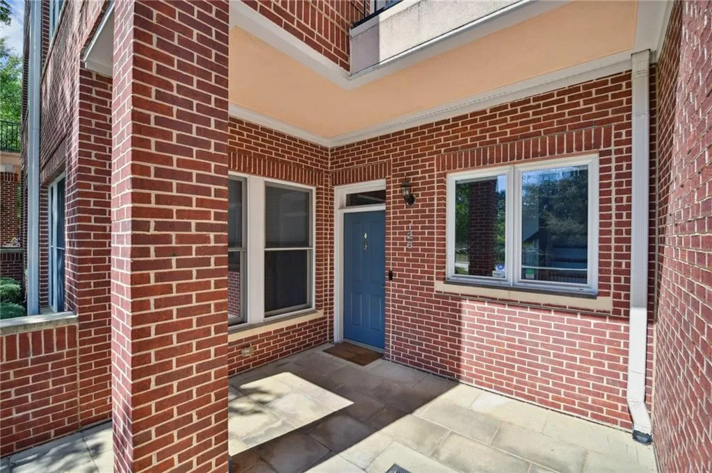 Private property entrance with a sunny patio.