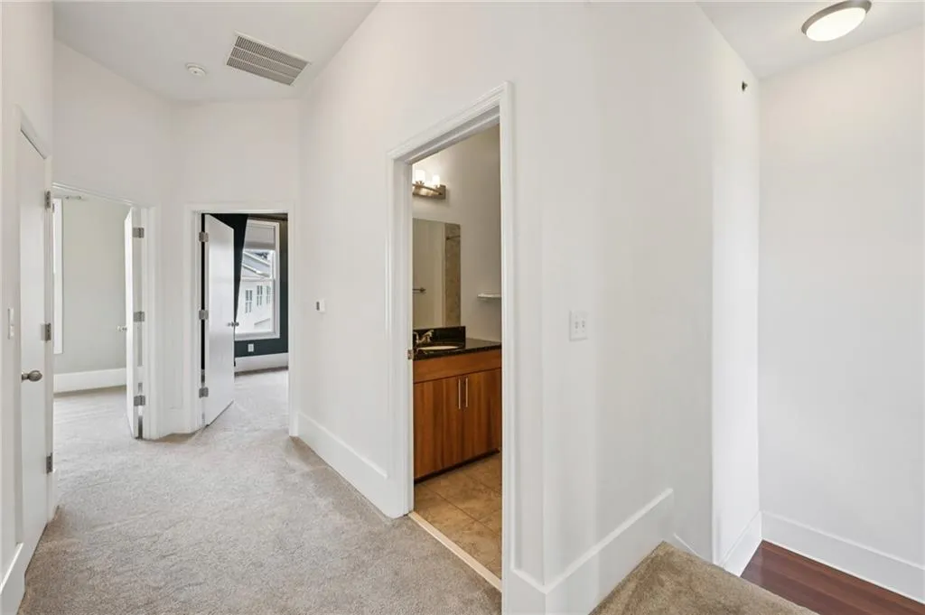 Nice wide hall on the top floor features upgraded carpeting, two secondary bedrooms, full bath and laundry.